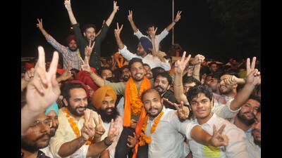 CYSS’s Ayush Khatkar celebrating his victory in the Panjab University polls with his supporters on Saturday. (Ravi Kumar/HT) CYSS’s Ayush Khatkar celebrating his victory in the Panjab University polls with his supporters on Saturday. (Ravi Kumar/HT)