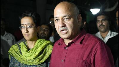 New Delhi, Oct 18 (ANI): Delhi Deputy Chief Minister Manish Sisodia speaks to the media after returning from the CBI headquarters over questioning in connection with the Delhi excise policy probe, as Aam Aadmi Party (AAP) MLA Atishi Marlena looks on, at his residence, in New Delhi on Monday. (ANI photo) (Ishant) New Delhi, Oct 18 (ANI): Delhi Deputy Chief Minister Manish Sisodia speaks to the media after returning from the CBI headquarters over questioning in connection with the Delhi excise policy probe, as Aam Aadmi Party (AAP) MLA Atishi Marlena looks on, at his residence, in New Delhi on Monday. (ANI photo) (Ishant)
