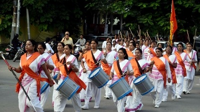 Volunteers of the Rashtriya Sevika Samiti, the women's wing of the Rashtriya Swayamsevak Sangh (RSS) take part in 'Path Sanchalan' as part of RSS Foundation Day celebrations, in Prayagraj, October 15. (ANI)