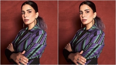 Kirti’s blazer featured striped in white, pastel green, violet and black. She further styled it with a black wide belt at the waist. (Instagram/@iamkirtikulhari) Kirti’s blazer featured striped in white, pastel green, violet and black. She further styled it with a black wide belt at the waist. (Instagram/@iamkirtikulhari)
