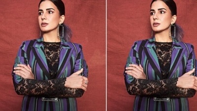 Kirti decked up in a black short dress with lace details and full sleeves, and layered her look with a striped blazer. (Instagram/@iamkirtikulhari) Kirti decked up in a black short dress with lace details and full sleeves, and layered her look with a striped blazer. (Instagram/@iamkirtikulhari)