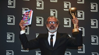 Author Shehan Karunatilaka holds the Booker Prize during a photo call after the announcement of his victory, at the Roundhouse, in London, October 17. (AP) Author Shehan Karunatilaka holds the Booker Prize during a photo call after the announcement of his victory, at the Roundhouse, in London, October 17. (AP)