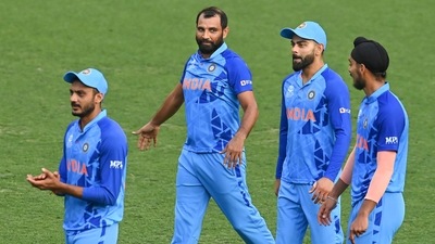 &nbsp;Indian players Virat Kohli, Mohammed Shami and others following their win in the ICC T20 World Cup warm-up cricket match against Australia at the Gabba in Brisbane. (PTI)