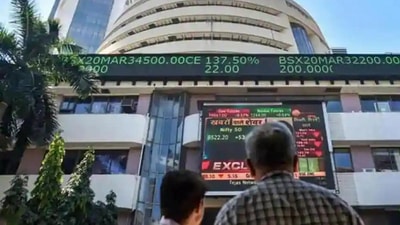 People watch the Sensex on a screen outside Bombay Stock Exchange (BSE) in Mumbai. (PTI File Photo)