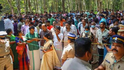 Police and locals at the place where the two women were allegedly murdered and buried for “human sacrifice” in Kerala. (PTI) Police and locals at the place where the two women were allegedly murdered and buried for “human sacrifice” in Kerala. (PTI)