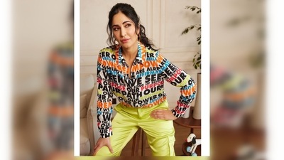 Katrina Kaif wore a colourful text printed shirt which she paired with neon green cargo trousers. (Instagram/@katrinakaif) Katrina Kaif wore a colourful text printed shirt which she paired with neon green cargo trousers. (Instagram/@katrinakaif)