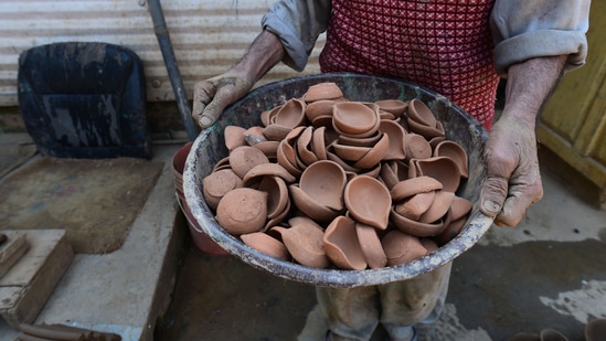 Ahead of Diwali, earthen lamp (diya) sellers at Rajasthan's Jaipur are hoping for good business this festive as they resume Diwali business.(HT Photo/Waseem Andrabi)