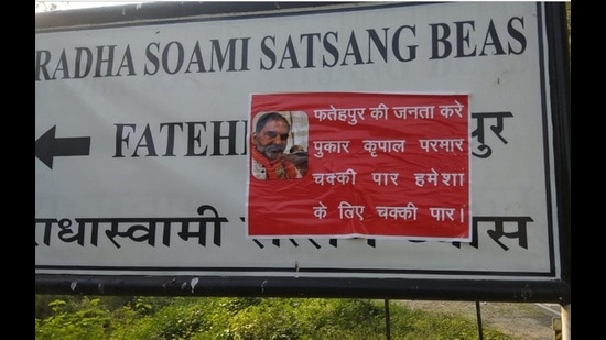 Posters pasted against former Rajya Sabha member Kripal Parmar in Fatehpur assembly segments of Kangra district. (HT Photo)