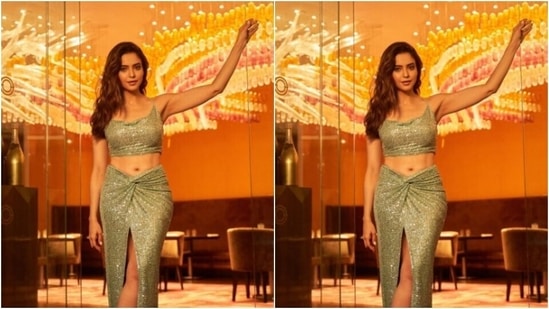 Aamna, for the pictures, picked a pastel green sequined cropped top with slip-in details. The blouse hugged her shape and featured a plunging neckline.(Instagram/@aamnasharifofficial)