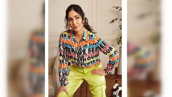 Katrina Kaif wore a colourful text printed shirt which she paired with neon green cargo trousers.(Instagram/@katrinakaif)