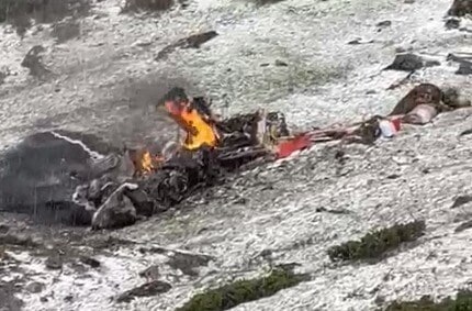 In images accessed by Hindustan Times, the crushed chopper can be seen burning in flames with parts of it scattered all over the site.