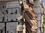 Italy Coffins Hanging: Coffins hanging on by a thread out of their niches in Italy.(Twitter) Italy Coffins Hanging: Coffins hanging on by a thread out of their niches in Italy.(Twitter)
