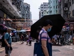 Hong Kong: A woman uses an umbrella to shield herself from the sun in Hong Kong.