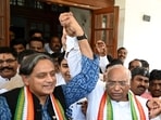 Congress leader Mallikarjun Kharge (centre) is congratulated by Shashi Tharoor after he got elected as the new Congress president, in New Delhi.