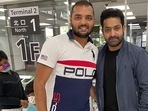 Jr NTR poses with a fan in Japan as his son looks on. Jr NTR poses with a fan in Japan as his son looks on.