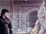 Amitabh Bachchan in a still from the iconic temple scene from Deewar.