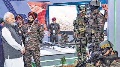 Prime Minister Narendra Modi with Defence Minister Rajnath Singh and others at the inauguration of the DefExpo 22, at Mahatma Mandir Convention and Exhibition Centre in Gandhinagar, Wednesday, Oct. 19, 2022. (PTI) Prime Minister Narendra Modi with Defence Minister Rajnath Singh and others at the inauguration of the DefExpo 22, at Mahatma Mandir Convention and Exhibition Centre in Gandhinagar, Wednesday, Oct. 19, 2022. (PTI)