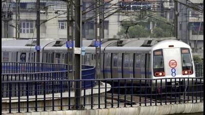 New Delhi, India - 19 August 2013 - The Eight coach metro leaving Ashok Nagar station on its maiden run in New Delhi India on Monday 19 August 2013, The Delhi Metro Rail Corporation is pressing the first eight-coach train into service on the crowded Blue line, as the Dwarka Sector 21 to Noida City Centre/Vaishali route. Photo by Mohd Zakir / Hindustan Times New Delhi, India - 19 August 2013 - The Eight coach metro leaving Ashok Nagar station on its maiden run in New Delhi India on Monday 19 August 2013, The Delhi Metro Rail Corporation is pressing the first eight-coach train into service on the crowded Blue line, as the Dwarka Sector 21 to Noida City Centre/Vaishali route. Photo by Mohd Zakir / Hindustan Times