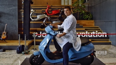 Bhavish Aggarwal, Co-founder and CEO of Ola, poses for a photograph with the new Ola electric scooter during its launch at the Ola headquarters in Bengaluru in this 2021 photo. Bhavish Aggarwal, Co-founder and CEO of Ola, poses for a photograph with the new Ola electric scooter during its launch at the Ola headquarters in Bengaluru in this 2021 photo.