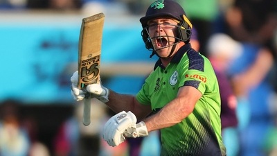 Ireland's Curtis Campher celebrates victory during the ICC men's Twenty20 World Cup 2022 cricket match between Ireland and Scotland at Bellerive Oval in Hobart (AFP)