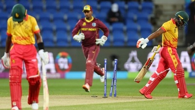Zimbabwe's Regis Chakabva (R) walks off the field after being bowled out. (AFP) Zimbabwe's Regis Chakabva (R) walks off the field after being bowled out. (AFP)