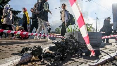Russia-Ukraine War: Local residents look at parts of an unmanned aerial vehicle (UAV), in Kyiv, Ukraine. (Reuters)