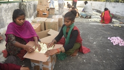 In preparation for the upcoming Deepostav, girls are seen packing cartons with cow dung diyas at Kanha, Lucknow. (Deepak Gupta/ HT Photo) 