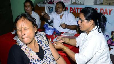 A healthcare worker administers a booster dose of Covid-19 vaccine to a beneficiary in Guwahati on Friday. (ANI) A healthcare worker administers a booster dose of Covid-19 vaccine to a beneficiary in Guwahati on Friday. (ANI)