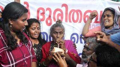 Social activist Daya Bai drinks coconut juice extended to her by her supporters to end her fast, in Kasaragod district on Wednesday. (ANI) Social activist Daya Bai drinks coconut juice extended to her by her supporters to end her fast, in Kasaragod district on Wednesday. (ANI)