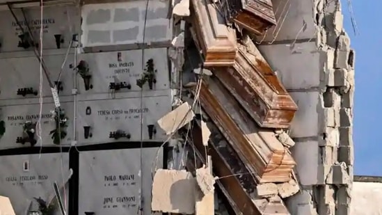 Italy Coffins Hanging: Coffins hanging on by a thread out of their niches in Italy.(Twitter)