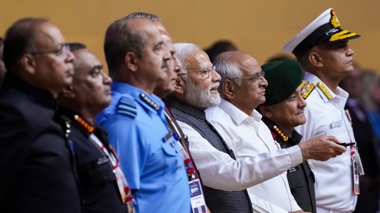 PM Modi unveiled the HAL HTT-40 (Hindustan Turbo Trainer-40) during the inauguration of DefExpo 22. Defence Secretary Ajay Kumar, Gujarat CM Bhupendra Patel, Chief of Defence Staff General Anil Chauhan, Chief of Air Staff Air Chief Marshal VR Chaudhari, Chief of Army Staff General Manoj Pande and Chief of Naval Staff Admiral R. Hari Kumar were also present at the ceremony.(PTI)