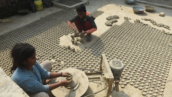 Earthen lamps being prepared at a family workshop ahead of Diwali festival in the Nanpur area of Chinhat in Lucknow. (Deepak Gupta/ HT Photo)