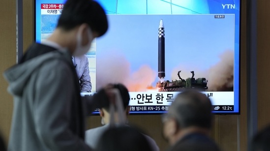 North Korea: A TV screen showing a news programme reporting about North Korea's missile launch with file footage.