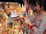 A woman holds the idols of Hindu deities ahead of the Hindu festival of Diwali at a market in Amritsar ahead of Diwali 2022. Renovate your home this festive season with these home decor ideas (Photo by Narinder NANU / AFP) A woman holds the idols of Hindu deities ahead of the Hindu festival of Diwali at a market in Amritsar ahead of Diwali 2022. Renovate your home this festive season with these home decor ideas (Photo by Narinder NANU / AFP)