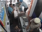 Following the incident, people are demanding action against the “unwarranted display” of the gun inside a mobile shop.