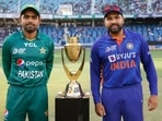 Pakistan captain Babar Azam and India skipper Rohit Sharma pose with Asia Cup photo