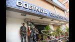 Security personnel outside the premises of builder Gabbu Singh, rumoured to be close aide of JD (U) president Lalan Singh during a raid by a central agency in Patna on Friday. (ANI) Security personnel outside the premises of builder Gabbu Singh, rumoured to be close aide of JD (U) president Lalan Singh during a raid by a central agency in Patna on Friday. (ANI)