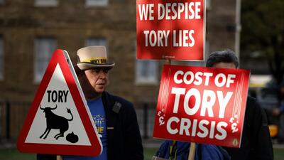 Demonstrators protest opposite parliament after Britain's Prime Minister Liz Truss resigned in London, on Thursday. (AP) Demonstrators protest opposite parliament after Britain's Prime Minister Liz Truss resigned in London, on Thursday. (AP)
