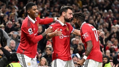 Manchester United's Portuguese midfielder Bruno Fernandes celebrates with teammates after scoring his team second goal during the English Premier League football match between Manchester United and Tottenham Hotspur at Old Trafford (AFP) Manchester United's Portuguese midfielder Bruno Fernandes celebrates with teammates after scoring his team second goal during the English Premier League football match between Manchester United and Tottenham Hotspur at Old Trafford (AFP)