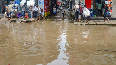 Incessant rains battered Bengaluru on Wednesday, flooding several areas and throwing normal life out of gear. The rains also lead to collapse of a wall near the Majestic that resulted in damaging several four-wheelers parked on the road. (PTI) Incessant rains battered Bengaluru on Wednesday, flooding several areas and throwing normal life out of gear. The rains also lead to collapse of a wall near the Majestic that resulted in damaging several four-wheelers parked on the road. (PTI)