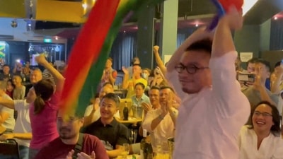 Singapore: A man waves a rainbow flag. (Reuters)