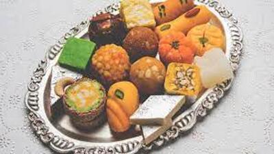 Peering through the glass display shelf, I feasted my eyes on the heaps of ‘imarti’ amid the lavish spread of sweetmeats in the shop. (HT File) Peering through the glass display shelf, I feasted my eyes on the heaps of ‘imarti’ amid the lavish spread of sweetmeats in the shop. (HT File)