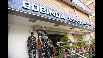 Security personnel outside the premises of builder Gabbu Singh, rumoured to be close aide of JD (U) president Lalan Singh during a raid by a central agency in Patna on Friday. (ANI)