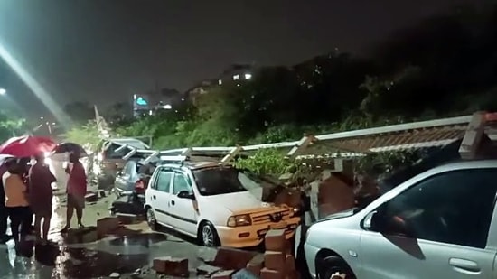 A compound wall of the Metro Rail collapsed and cars parked close by came under mounds of rubble, officials said on Thursday.(ANI)