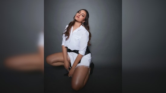 Sonakshi Sinha's outfit comprises a white cropped shirt and ripped shorts.(Instagram/@aslisona)