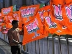 A Bharatiya Janta Party worker erecting BJP flags. (Representational image)