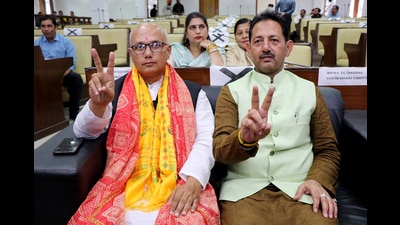 BJP councillor Rajinder Sharma (left) and party in-charge of Doda Baldev Singh Billawaria show victory signs after being elected as the mayor and deputy mayor of the Jammu municipal corporation on Friday. (ANI) BJP councillor Rajinder Sharma (left) and party in-charge of Doda Baldev Singh Billawaria show victory signs after being elected as the mayor and deputy mayor of the Jammu municipal corporation on Friday. (ANI)