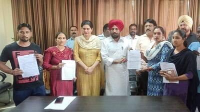MLA Kulwant Singh Sidhu handing over an appointment letter to an employee in Ludhiana. (HT PHOTO)