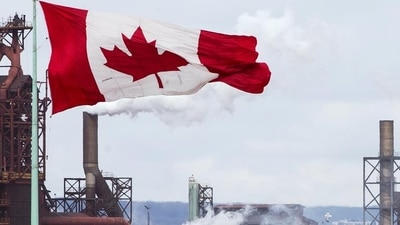 Canada Provincial Nominee Programs: A Canada flag flies in Hamilton, Ontario. Canada Provincial Nominee Programs: A Canada flag flies in Hamilton, Ontario.