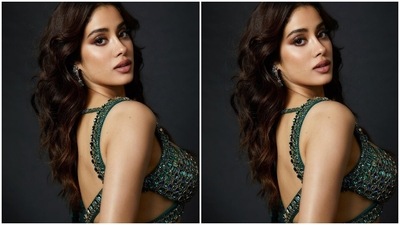 Janhvi teamed the blouse with a heavy green-coloured lehenga that comes in a mermaid-like layered silhouette. It also has a high-rise waistline, figure-accentuating fitting, tulle trimmings on the hem, and sequin embellishments. (Instagram) Janhvi teamed the blouse with a heavy green-coloured lehenga that comes in a mermaid-like layered silhouette. It also has a high-rise waistline, figure-accentuating fitting, tulle trimmings on the hem, and sequin embellishments. (Instagram)